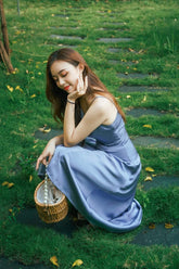 Silk slip midi dress with cowl neckline and adjustable straps for graceful summer styling